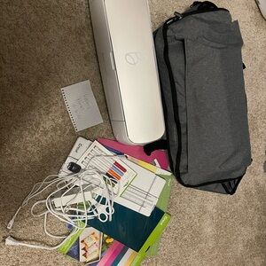 Cricut Maker Machine with Gray Bag and Craft Supplies